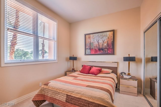 carpeted bedroom featuring a closet