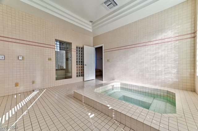 view of pool with an indoor in ground hot tub