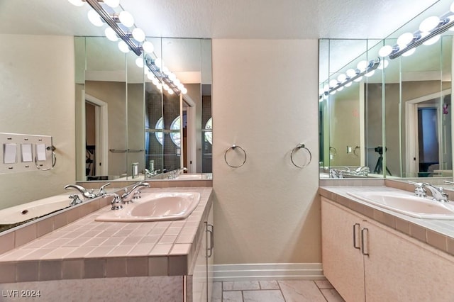 bathroom featuring vanity and a textured ceiling