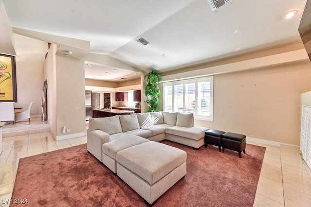 tiled living room featuring lofted ceiling