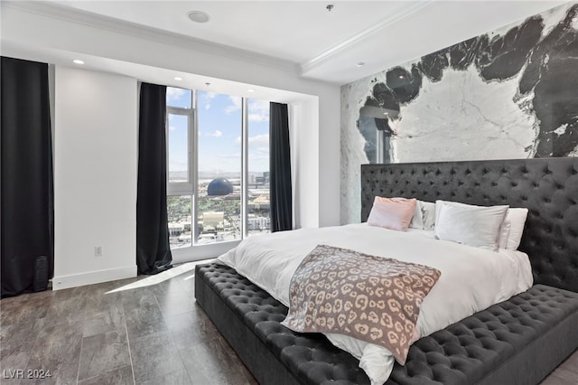 bedroom with recessed lighting, crown molding, baseboards, and wood finished floors