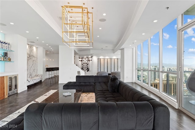 living area featuring floor to ceiling windows, a dry bar, baseboards, and recessed lighting