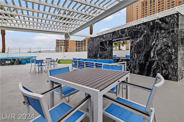 view of patio / terrace featuring outdoor dining area, fence, and a pergola