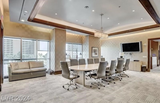 dining space with lofted ceiling, recessed lighting, a raised ceiling, and light colored carpet