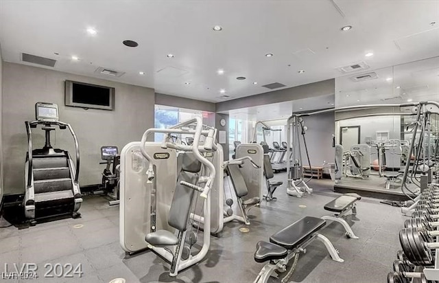 exercise room featuring recessed lighting and visible vents