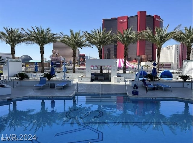 community pool with a patio area