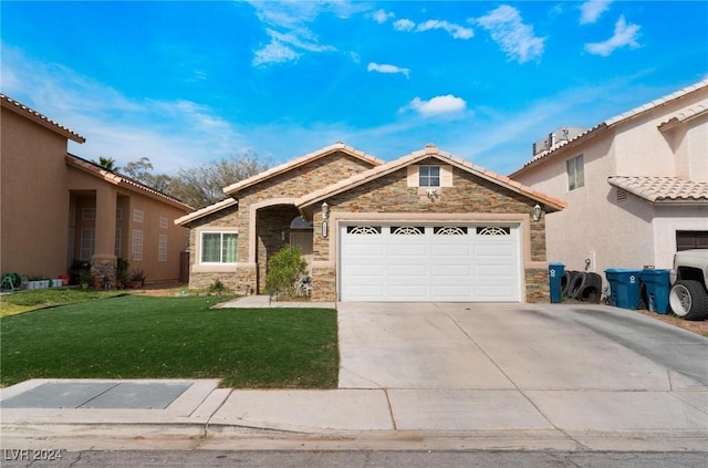 view of front facade with a garage and a front yard