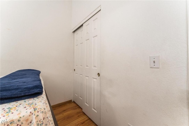 bedroom featuring a closet and light hardwood / wood-style flooring