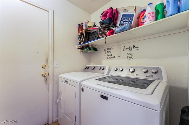 clothes washing area featuring separate washer and dryer