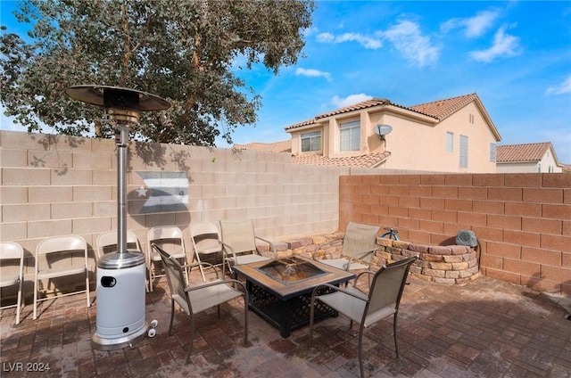 view of patio featuring a fire pit