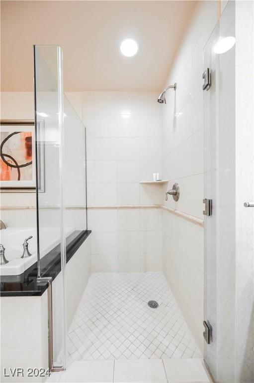 bathroom featuring shower with separate bathtub