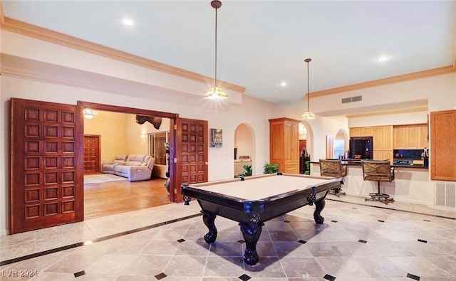 recreation room with ornamental molding and billiards