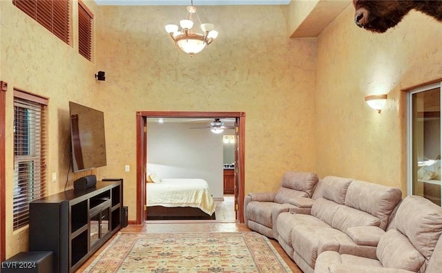 living room featuring a high ceiling and a notable chandelier