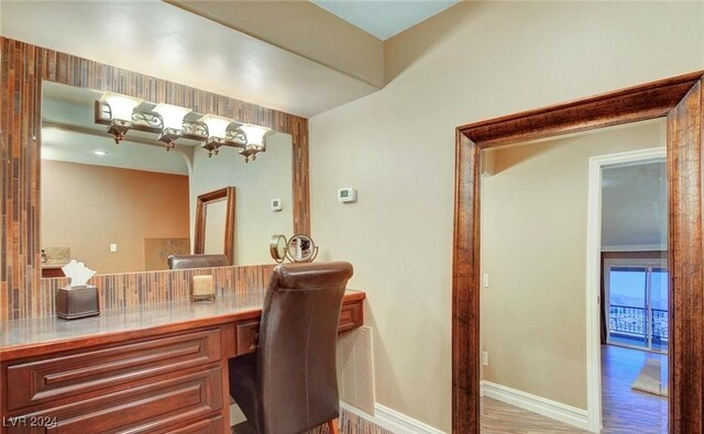 bathroom with hardwood / wood-style floors