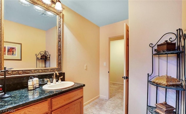 bathroom with tile patterned floors and vanity