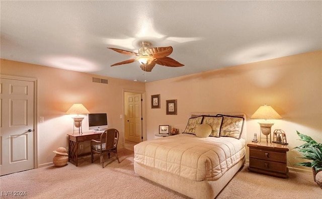 bedroom with ceiling fan and light colored carpet