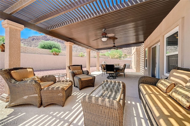 view of patio / terrace with ceiling fan, outdoor lounge area, and a pergola