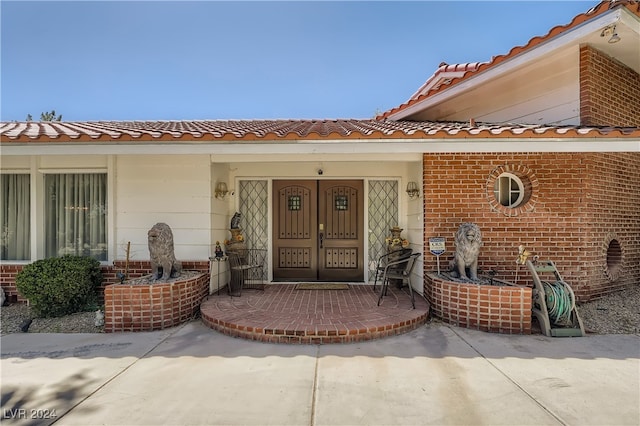 view of exterior entry featuring french doors