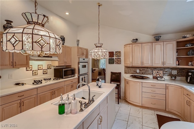 kitchen featuring tasteful backsplash, multiple ovens, extractor fan, light brown cabinetry, and light tile patterned floors