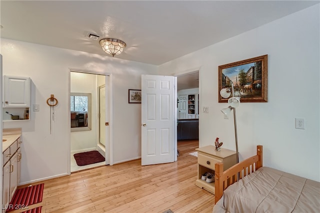 bedroom with light hardwood / wood-style floors