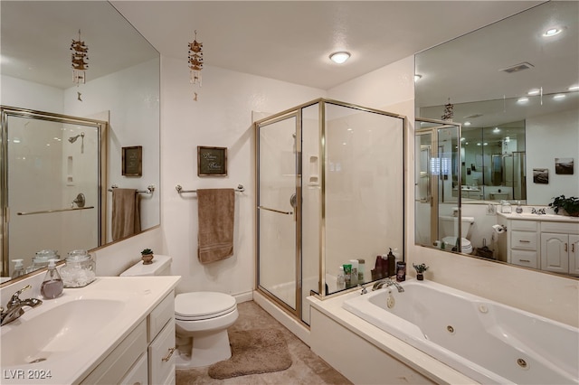 full bathroom with tile patterned floors, vanity, independent shower and bath, and toilet