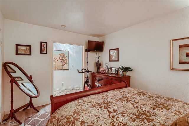 bedroom with wood-type flooring