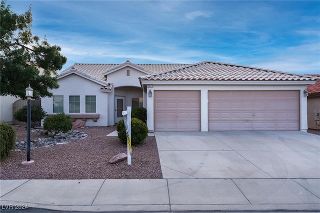 view of front of home with a garage