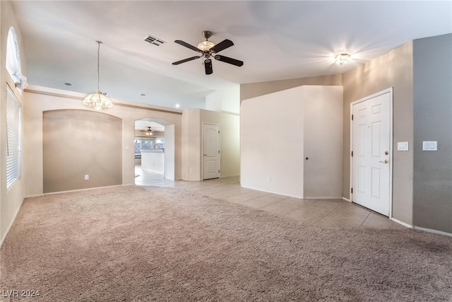 carpeted spare room featuring ceiling fan