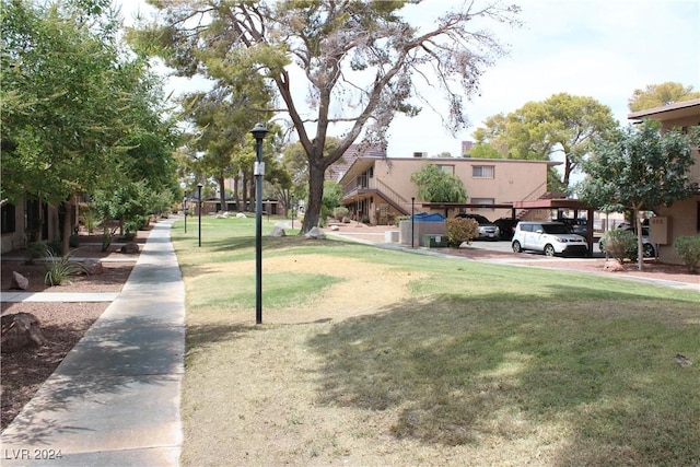 view of property's community with a yard