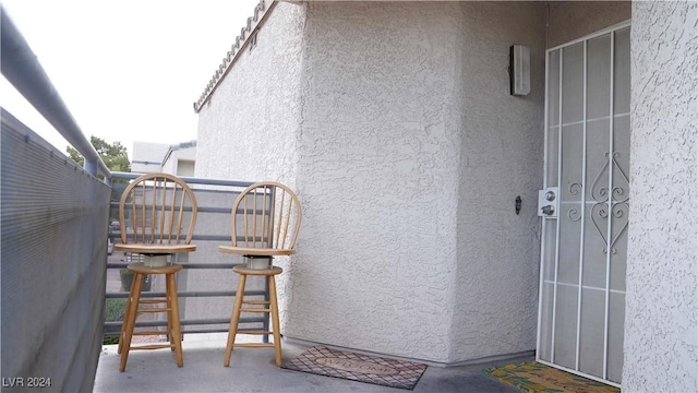 doorway to property with stucco siding