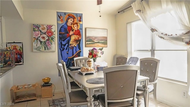 dining space featuring tile patterned floors