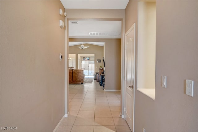 hall with light tile patterned flooring