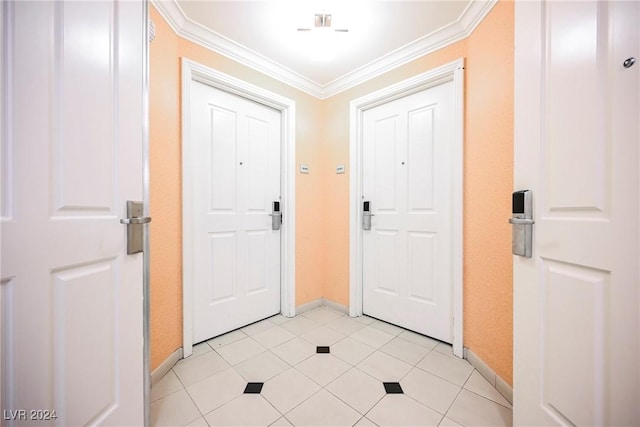 foyer featuring light tile patterned flooring, crown molding, and baseboards