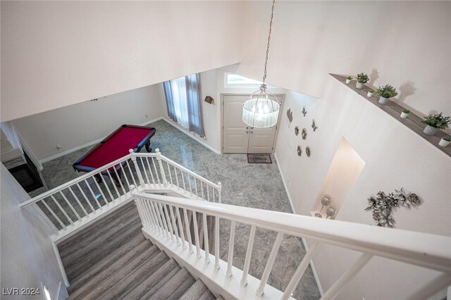 stairway with high vaulted ceiling