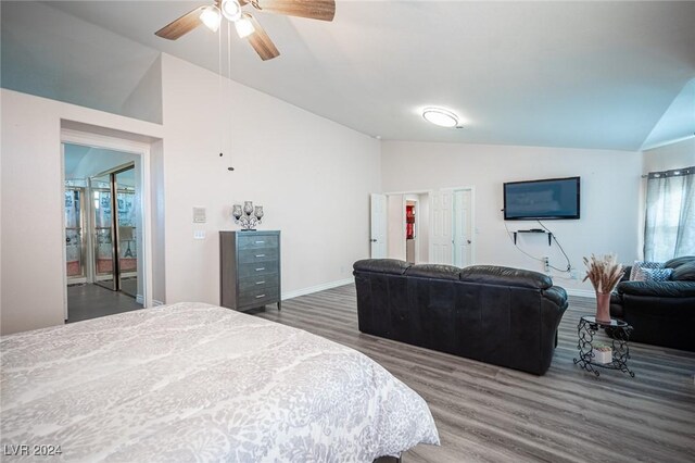 bedroom featuring lofted ceiling, dark wood-type flooring, and ceiling fan