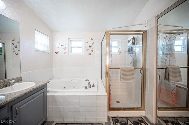 bathroom with vanity and plus walk in shower