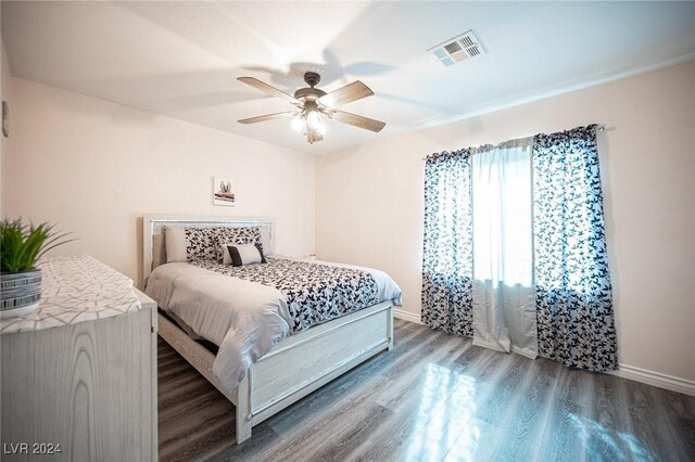 bedroom featuring hardwood / wood-style flooring and ceiling fan