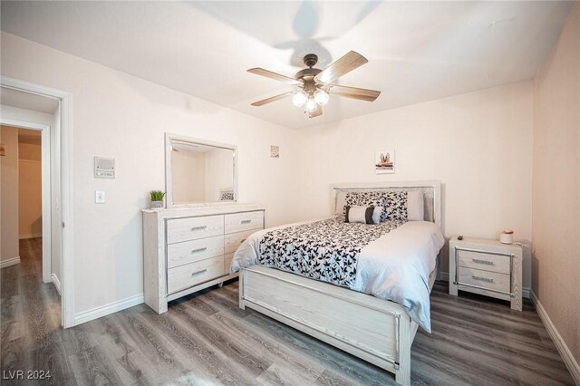 bedroom featuring ceiling fan and wood-type flooring