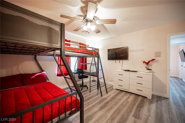 bedroom featuring hardwood / wood-style flooring and ceiling fan