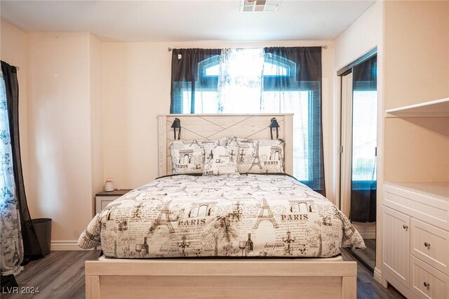 bedroom featuring dark wood-type flooring