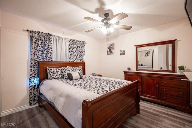 bedroom featuring hardwood / wood-style floors and ceiling fan