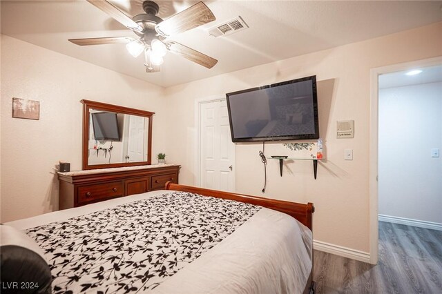 bedroom featuring hardwood / wood-style flooring and ceiling fan