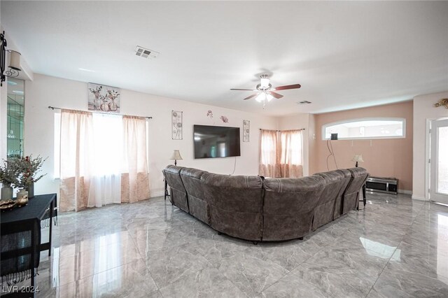 living room featuring ceiling fan