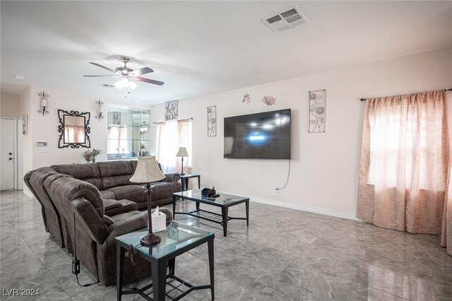 living room with ceiling fan