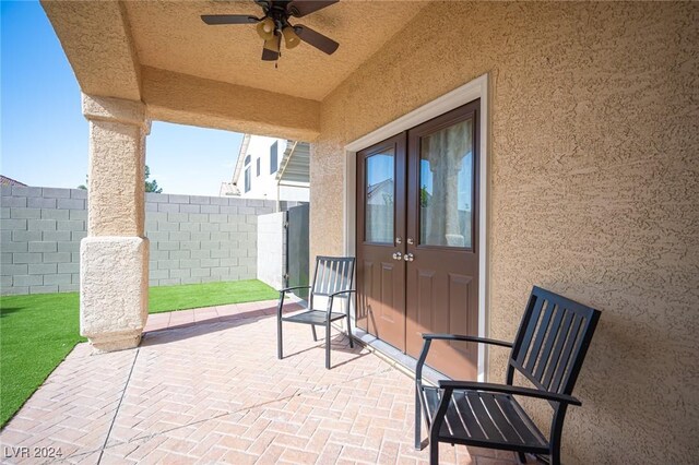 view of patio featuring ceiling fan