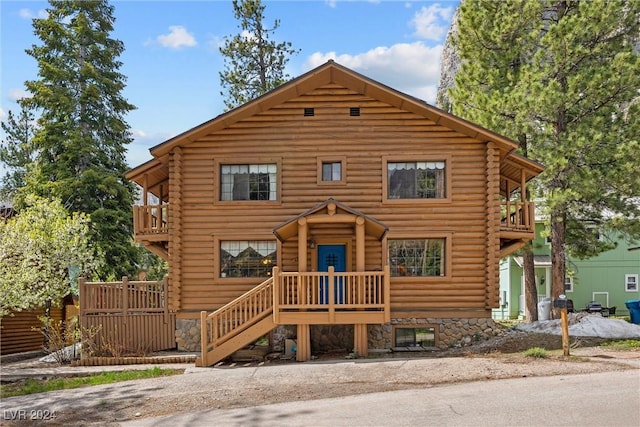 log-style house with a balcony