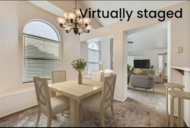 dining room featuring a chandelier, vaulted ceiling, and light colored carpet