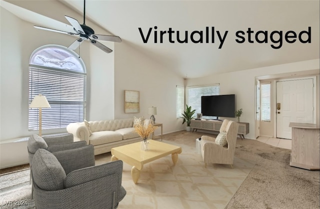 carpeted living room featuring high vaulted ceiling and ceiling fan