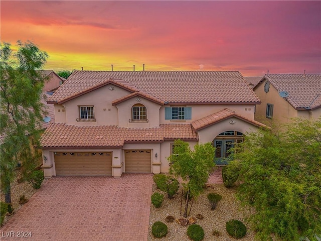 mediterranean / spanish-style house featuring a garage