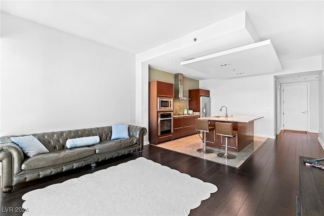 living room with sink and dark hardwood / wood-style floors